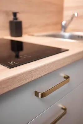 a kitchen counter with a sink and a cutting board at Theatre 9 Apartments by Adrez in Prague