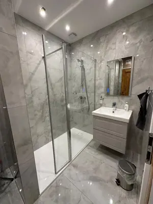 a bathroom with a shower and a sink at Cozy New Loft Apartment in Prague