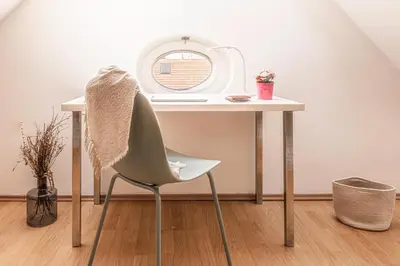 a white desk with a chair and a mirror at Prague Days - Airy Duplex with Terrace and AC in Prague