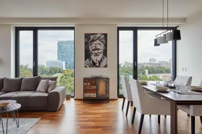 a living room with a couch and a dining room table at Spacious Condo in Nusle by Prague Days in Prague