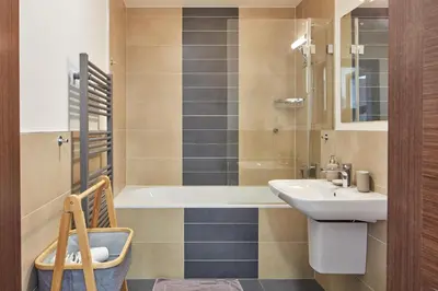 a bathroom with a sink and a bath tub at Spacious Condo in Nusle by Prague Days in Prague