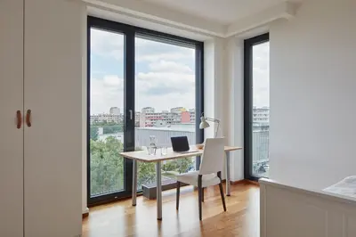 an office with a desk with a laptop on it at Spacious Condo in Nusle by Prague Days in Prague