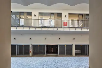 a view of a building with two floors and a balcony at Prague Days - One-bedroom Apartment with Workspace by Vltava River in Smíchov in Prague