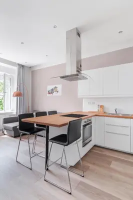 a room with a black table and a wooden door at Prague Days - One-bedroom Apartment with Courtyard View in Karlín in Prague