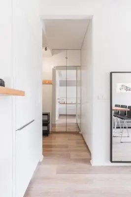 a living room with a gray couch and a table at Prague Days - One-bedroom Apartment with Courtyard View in Karlín in Prague