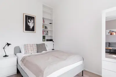 a white bathroom with a shower and a sink at Prague Days - One-bedroom Apartment with Courtyard View in Karlín in Prague