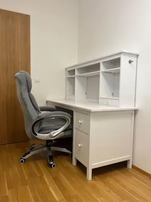 an office with a desk and a chair in a room at Apartman Holesovice,balkon,garaz in Prague