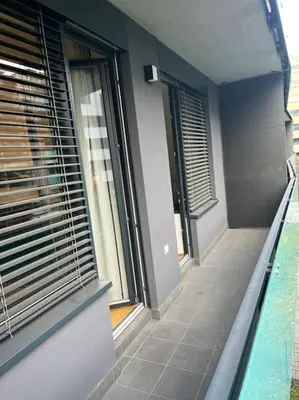 a balcony of a building with windows and a swimming pool at Apartman Holesovice,balkon,garaz in Prague