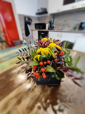 a bouquet of flowers sitting on a table at Vibe House Prague in Prague