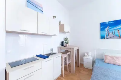 a small kitchen with a sink and a desk at Favorite apartment in the center of Prague 1 in Prague