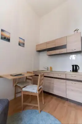 a kitchen with a table and a chair in a room at Favorite apartment in the center of Prague 1 in Prague