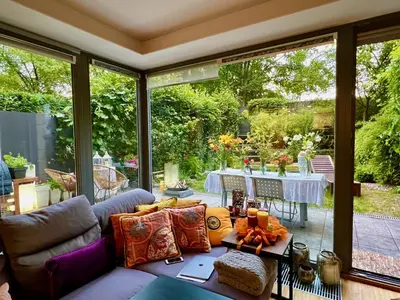 a living room with a couch and a table at Romantic stay overlooking Prague in Prague