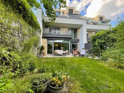 a house with a yard with some plants in it at Romantic stay overlooking Prague in Prague