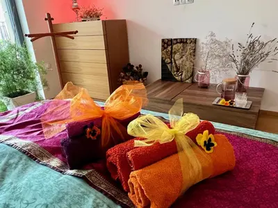 a group of colorful towels sitting on a bed at Romantic stay overlooking Prague in Prague