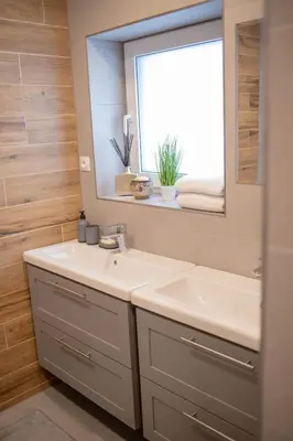 a bathroom with a sink and a mirror at Rezidence Kbely - Free Parking in Prague