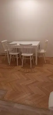 a table and two chairs and a white table and chairs at Apartman Josef in Prague