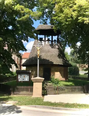 a statue of a cross on top of a building at Zelený grunt in Dřínov