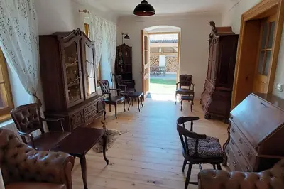 a living room with chairs and a table in a room at degustační dům in Babice