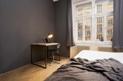 a white van parked in front of a building at Prague Days - Family-friendly Apartment with Netflix in quiet Vinohrady in Prague