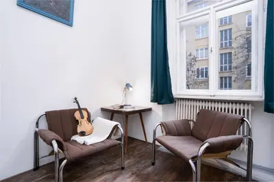 a large white bed with white sheets and pillows at Prague Days - Family-friendly Apartment with Netflix in quiet Vinohrady in Prague