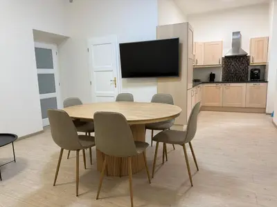 a bedroom with a bed and a flat screen tv at Spacious Apartment on Wenceslas Square in Prague