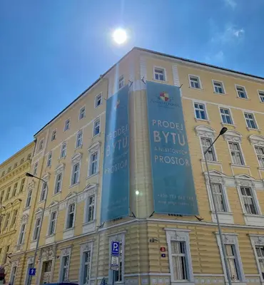 a building with a sign on the side of it at AngeloRoma Apartment in the center in Prague