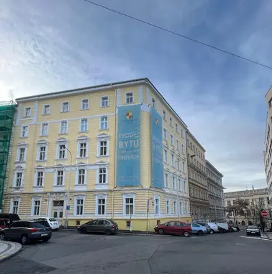 a large building with a large blue sign on it at AngeloRoma Apartment in the center in Prague