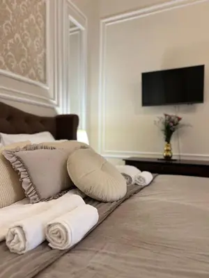 a room with a couch with towels on the floor at AngeloRoma Apartment in the center in Prague