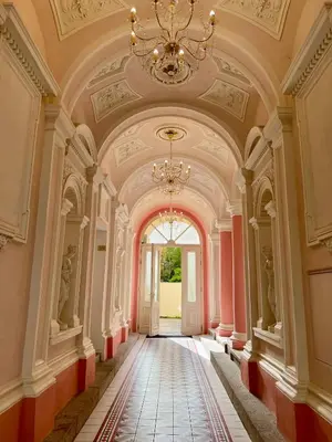 a hallway of a building with a chandelier at AngeloRoma Apartment in the center in Prague