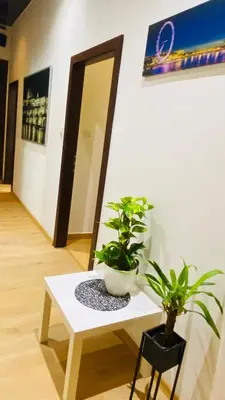 a white table with two potted plants on it at Hotel Apartment in square praha 2 in Prague