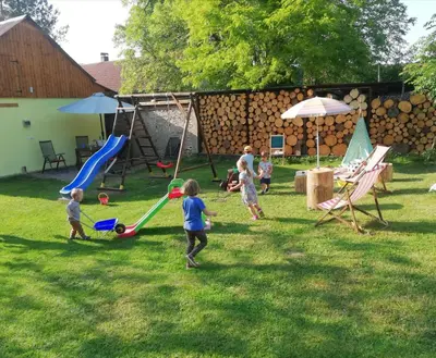 a group of children playing in a yard at Domeček u Josefa in Mělník