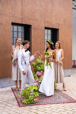 a bride and groom and their wedding party at Aparthotel Na Klenici in Mladá Boleslav