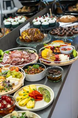 a buffet of different types of food on a table at Aparthotel Na Klenici in Mladá Boleslav