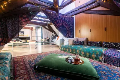 a living room with a couch and a table at Fairytale Duplex - Billiard - Whirlpool - Home Cinema - Old Town in Prague