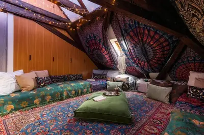 a living room with a couch and a table at Fairytale Duplex - Billiard - Whirlpool - Home Cinema - Old Town in Prague
