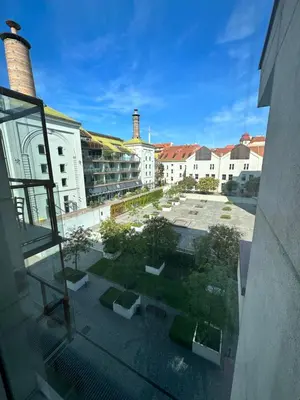 a view of a courtyard from a window of a building at Cozy apartment in Prague