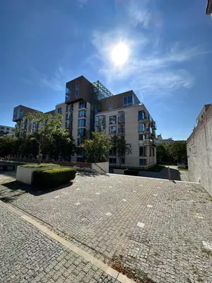 an empty parking lot in front of a building at Cozy apartment in Prague