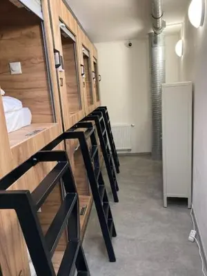 a row of lockers in a row in a room at Capsule hostel Andel Centre SPIRIT in Prague