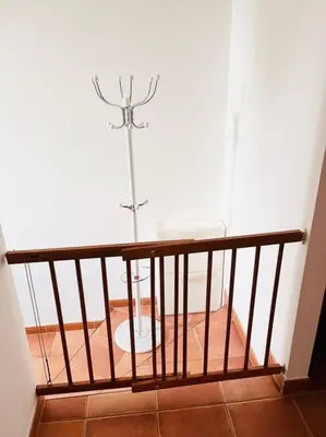 a view of a room with a metal pole at Apartmán se zahradou 20 minut do centra Prahy in Ořech