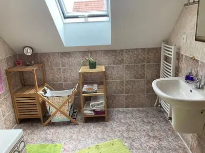 a bathroom with a sink and a tub and a sinkessment at Spacious villa with an outdoor pool in Černošice in Černošice