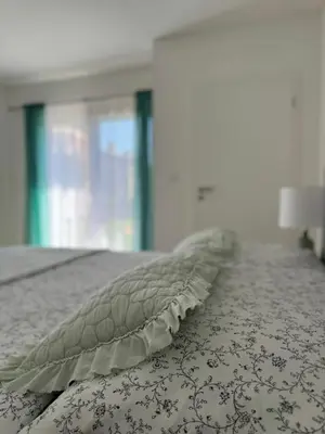 a pillow sitting on top of a bed at Apartmán Květinová zahrada in Prague