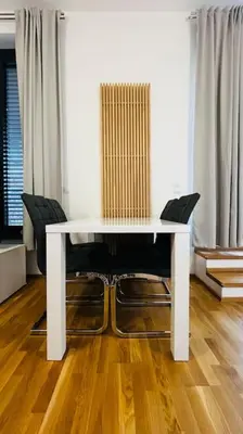 a white table and chairs in a living room at Apartment Holesovice, garden, garage in Prague