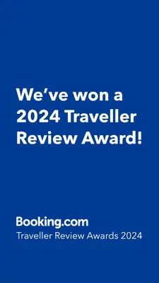 a blue sign that says weve won a traveler review award at Apartment Holesovice, garden, garage in Prague
