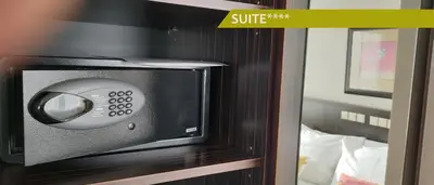 a microwave on a wall in a hotel room at Hotel Ludmila in Mělník