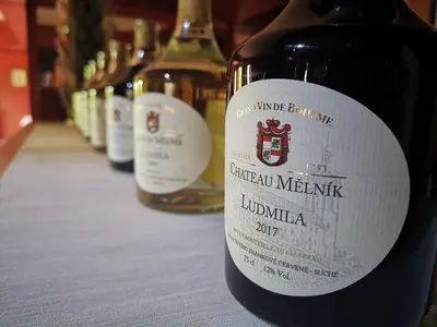 a bottle of wine sitting on top of a table at Hotel Ludmila in Mělník