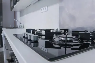 a kitchen with a stove top in a kitchen at Modern Apartment in the Center of Prague in Prague