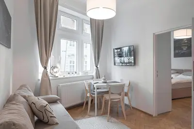 a living room with a couch and a table at Skolska Junior apartment in Prague