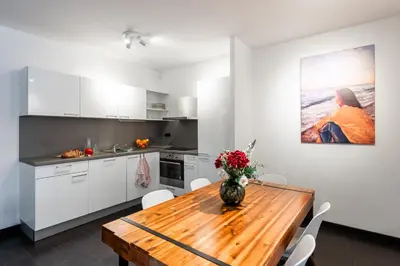 a living room with two mirrors and a couch at Spacious apartments near Karlín Square in Prague