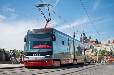 a tram on a street in a city at Cozy Homestay at Prague Main Station in Prague