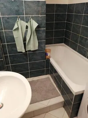a bathroom with a tub and a toilet and a sink at 2 Bedrooms close Vyšehrad - Congress centrum in Prague
